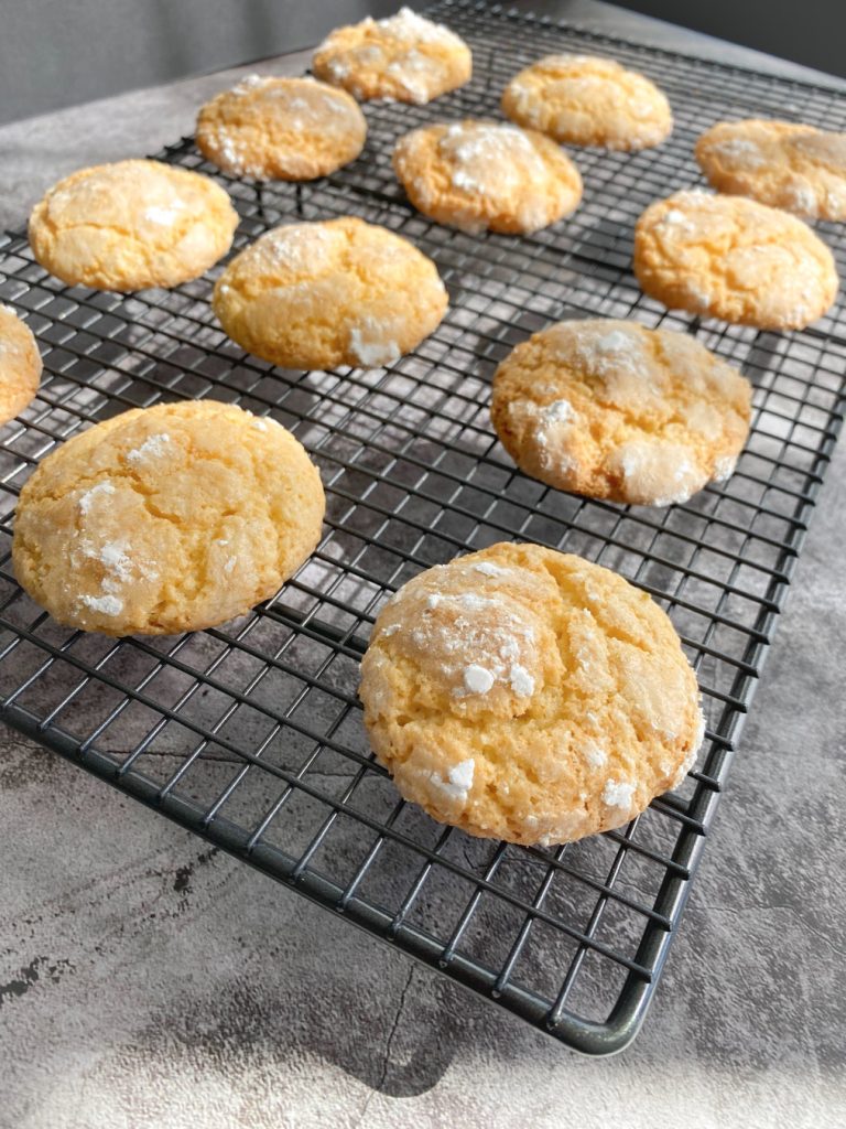 key lime crinkle cookies over a cooling rack