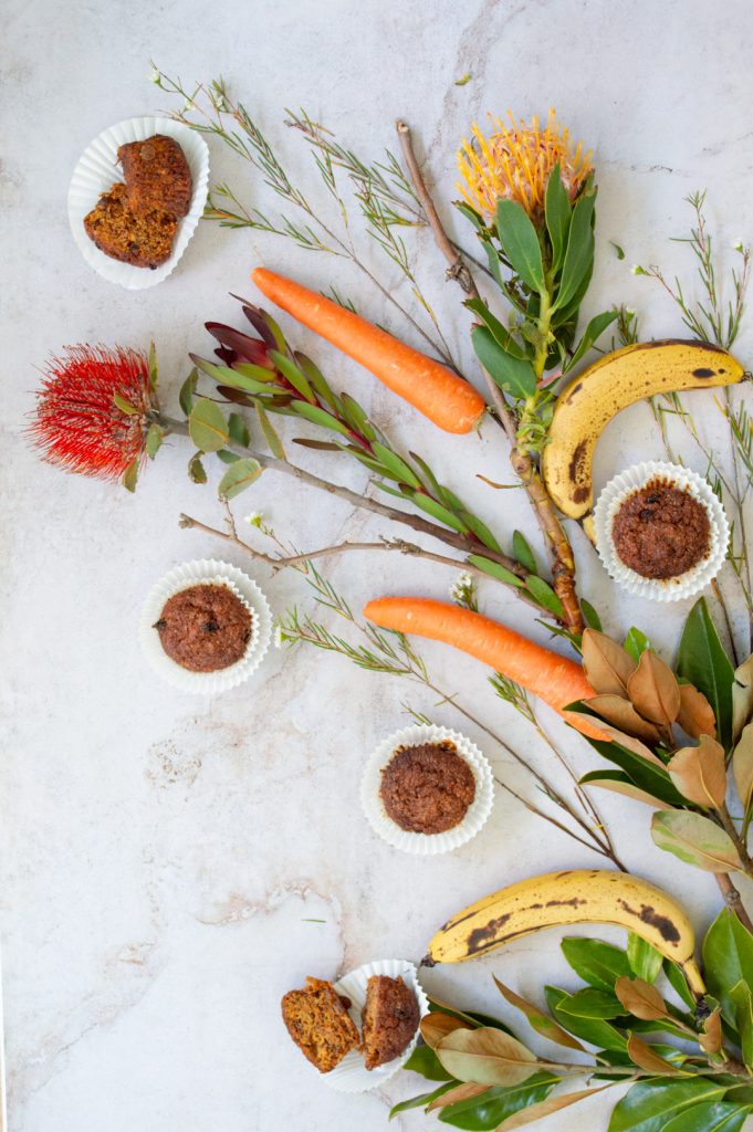 a composition with muffins and carrots and bananas