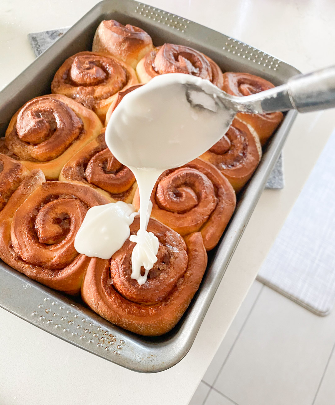 start drizzling the cinnamon rolls