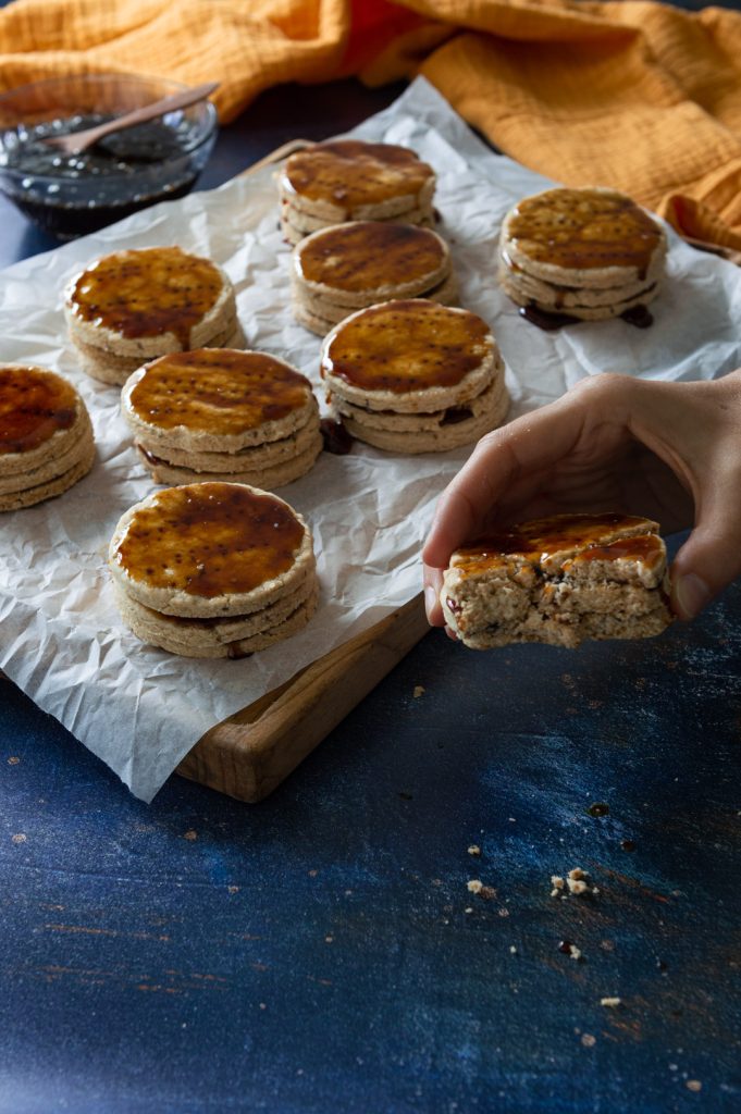 Peruvian Alfajores de Miel with a hand with one