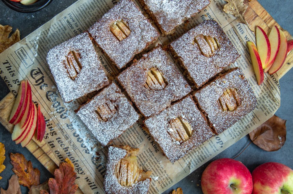 one of the pieces of the apple coffee cake with a bite 